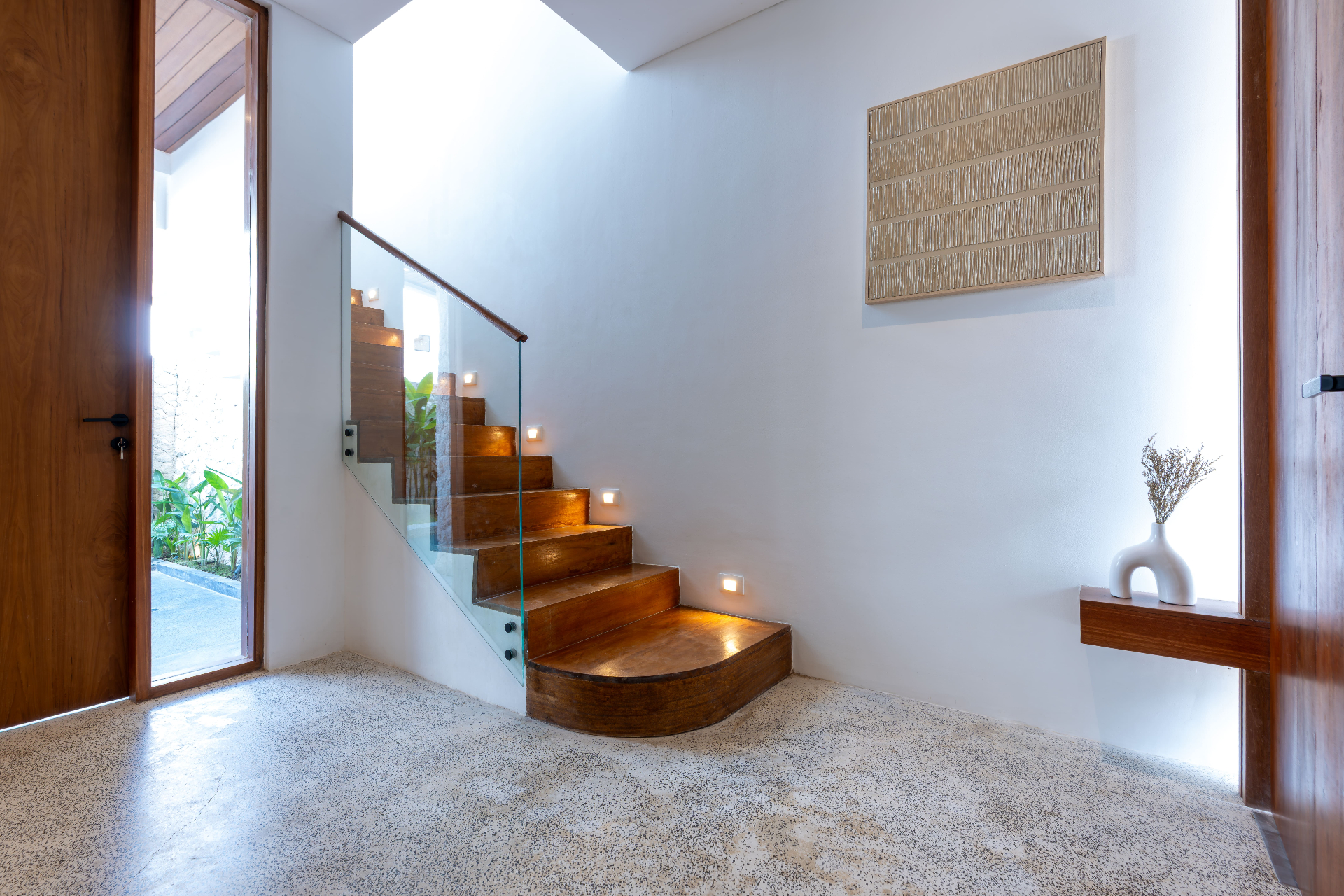 Entry hall with sculpted ironwood stair